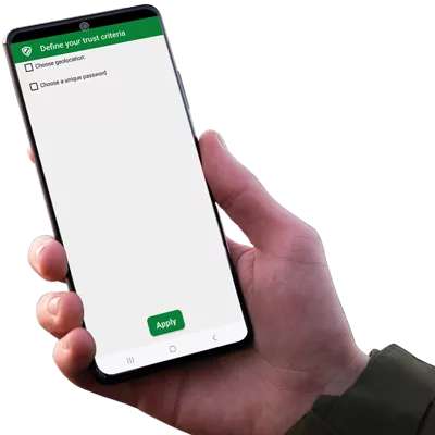 Right hand holding an Android NFC phone displaying the SeedNFC application by Freemindtronic, showing a screen to define trust criteria including geolocation and password