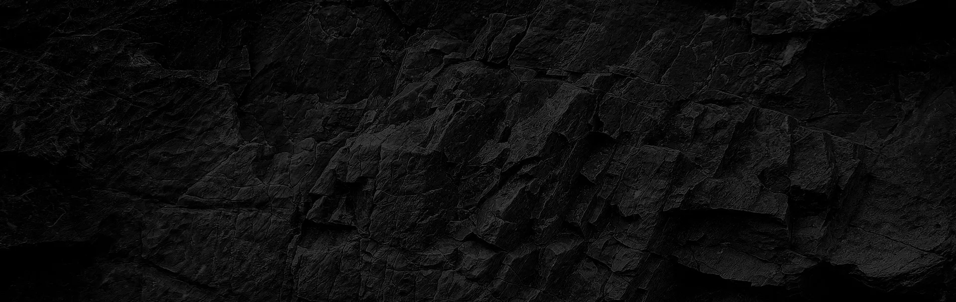 Textured dark rock surface, a visual metaphor for solid security.